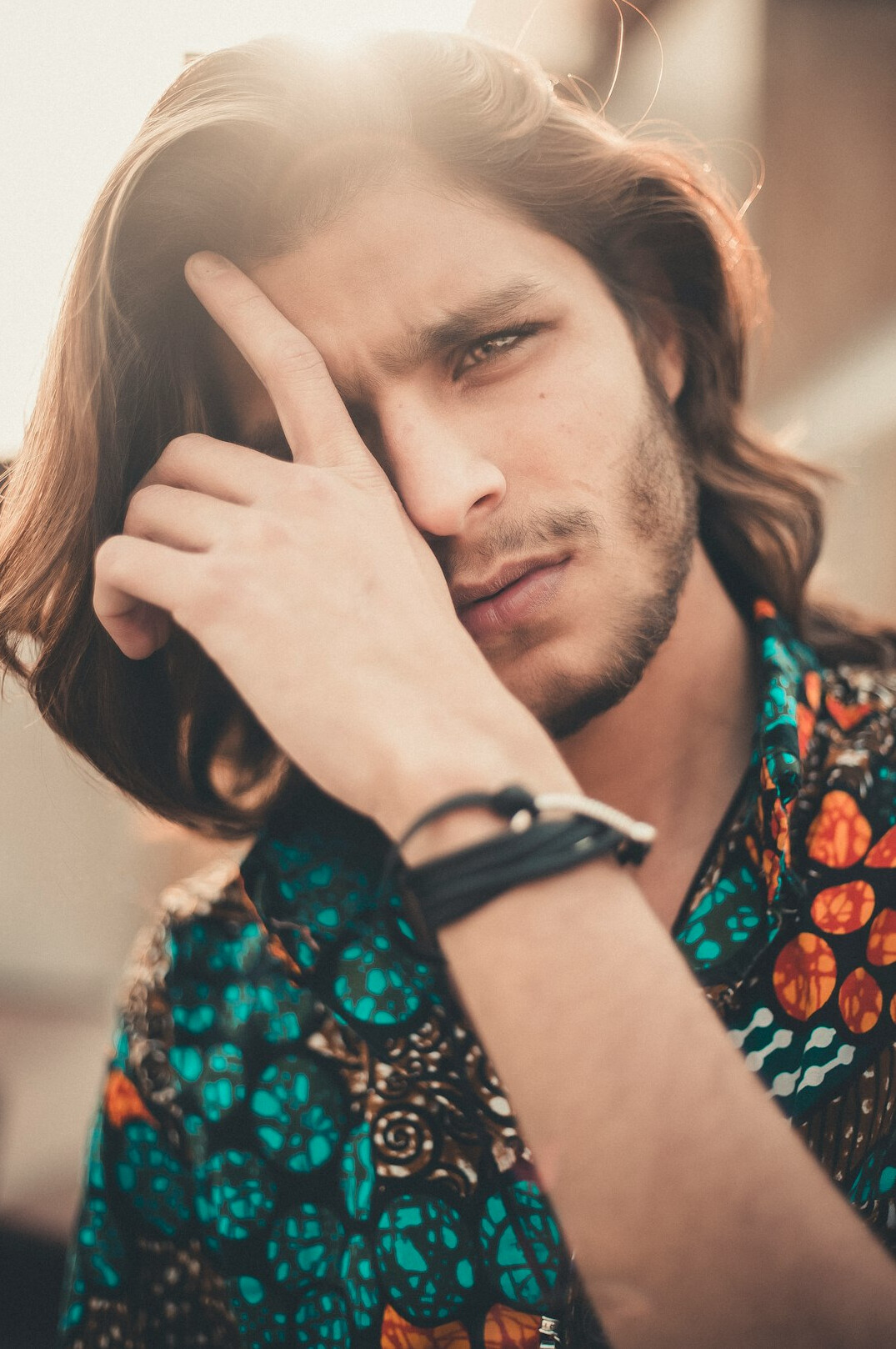 Portrait of a young man with a beard in a casual shirt